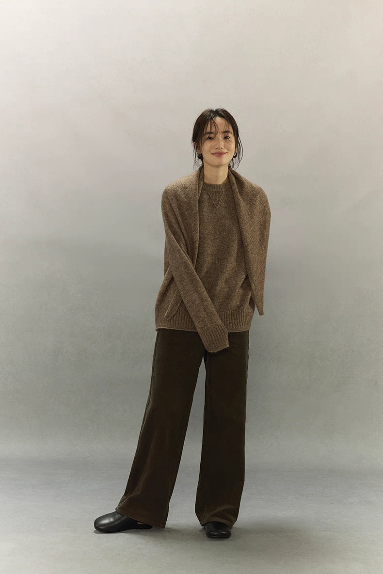 Model wearing light coffee brown cashmere blend sweater, relaxed fit full body view.