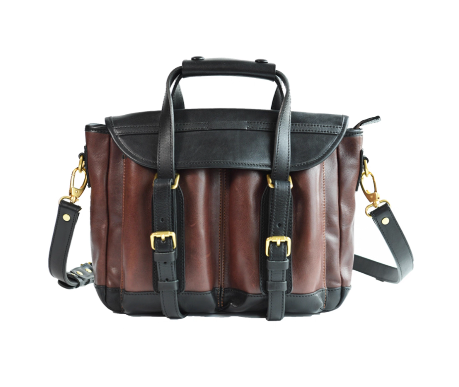 Front view of two-tone Italian leather camera satchel with black and brown panels