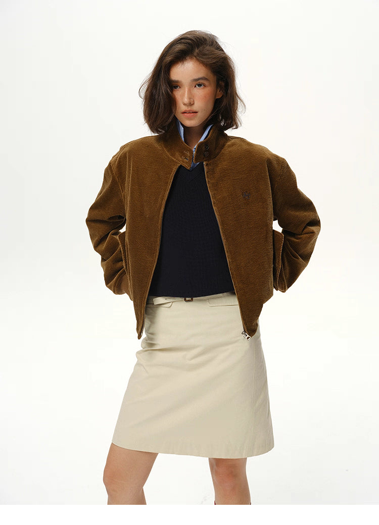 model wearing coffee brown corduroy jacket with hands in pockets