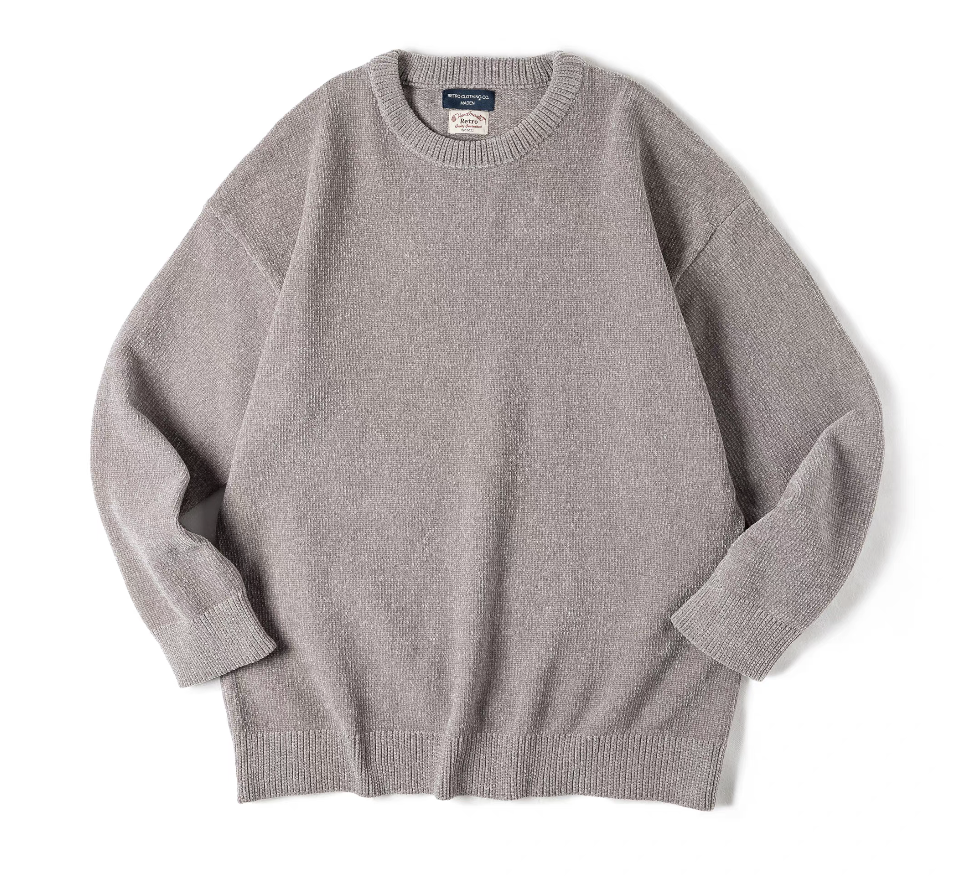 Light gray chenille knit sweater flat lay showing ribbed cuffs and hem