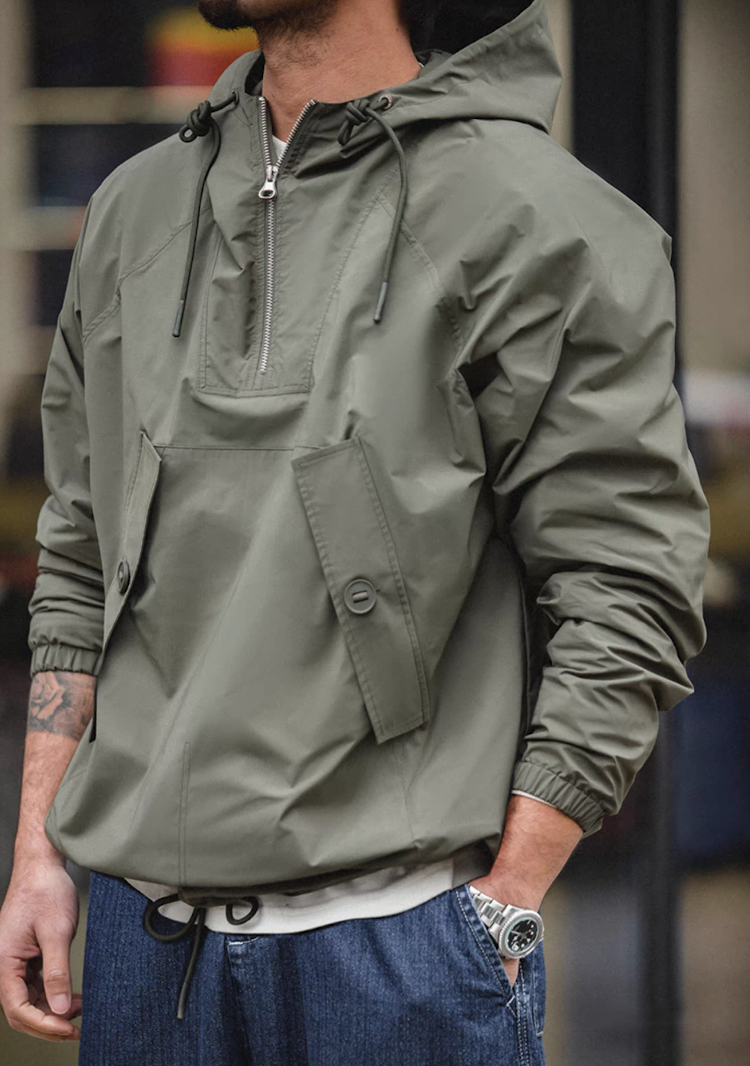 Side angle showing structure and pocket details of lightweight anorak