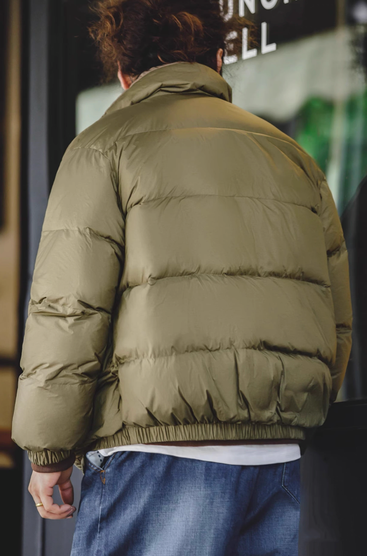 Back view of army green Reversible Down Jacket showing quilted texture and fit