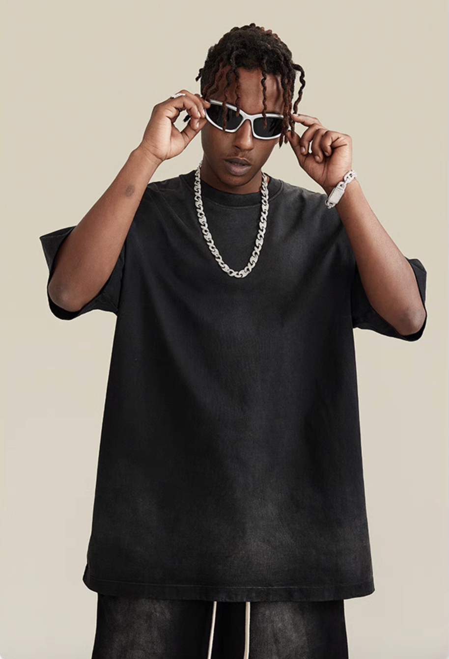 Casual gradient oversized t-shirt in black worn by model close-up view