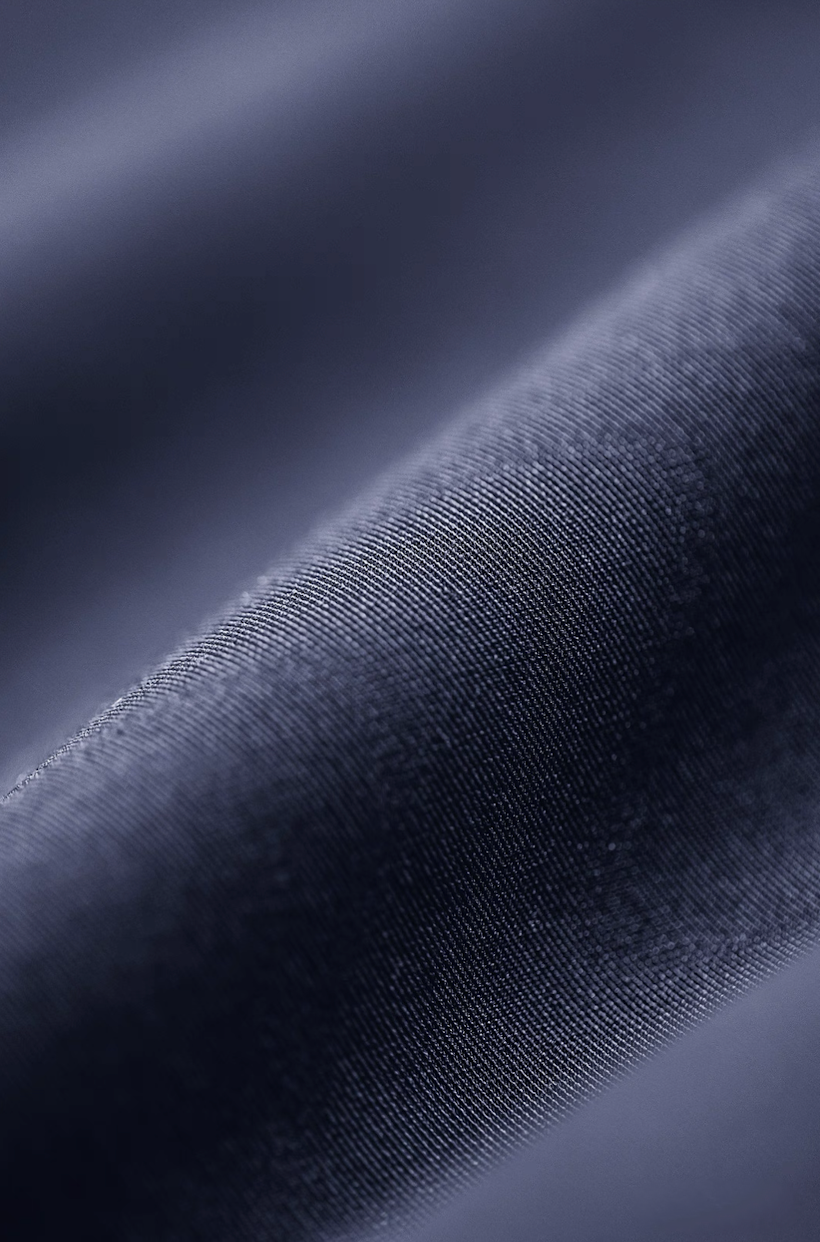 Smooth polyester fabric texture of navy bomber jacket