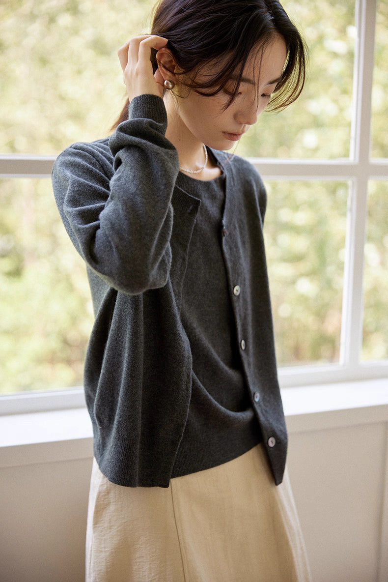 Close-up of cardigan texture and genuine shell buttons