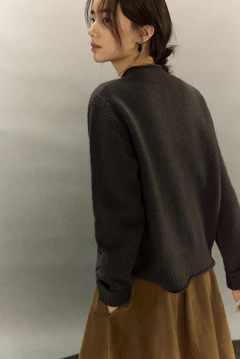 Side-back view of charcoal gray yak wool cardigan highlighting soft fuzzy texture and relaxed fit