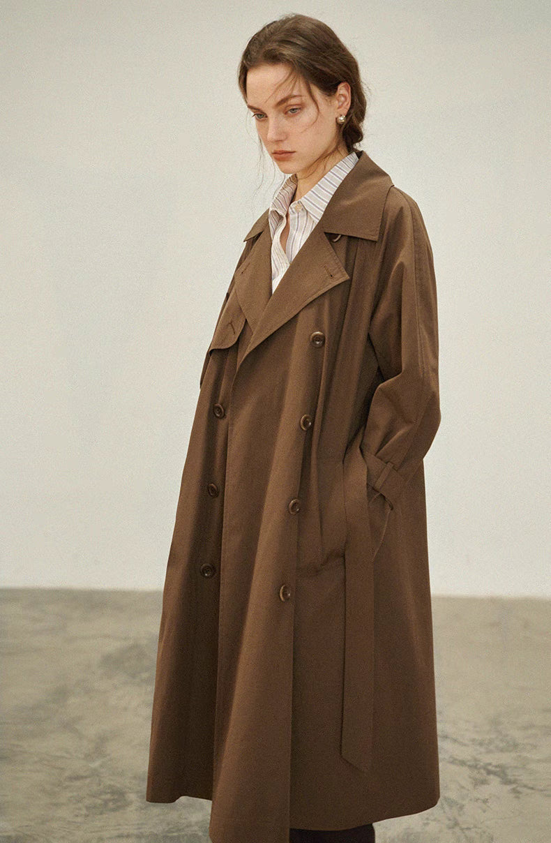 Dark brown short trench coat front view with double breasted buttons and relaxed oversized fit