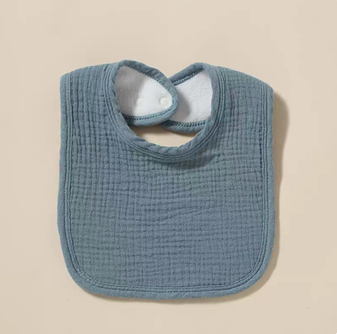 Blue baby cotton gauze bib with textured muslin fabric and rounded design