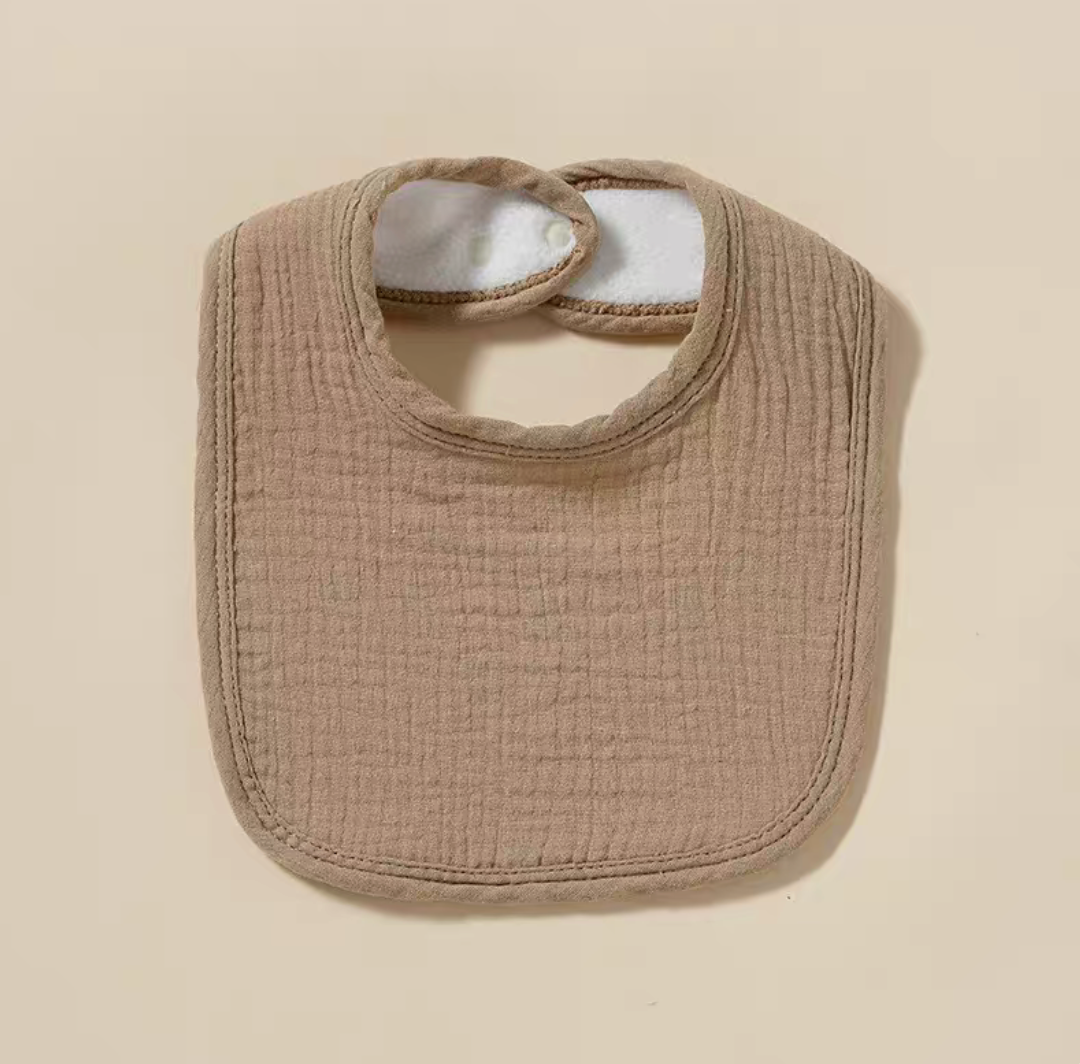 Brown baby cotton gauze bib with soft absorbent fabric and adjustable closure