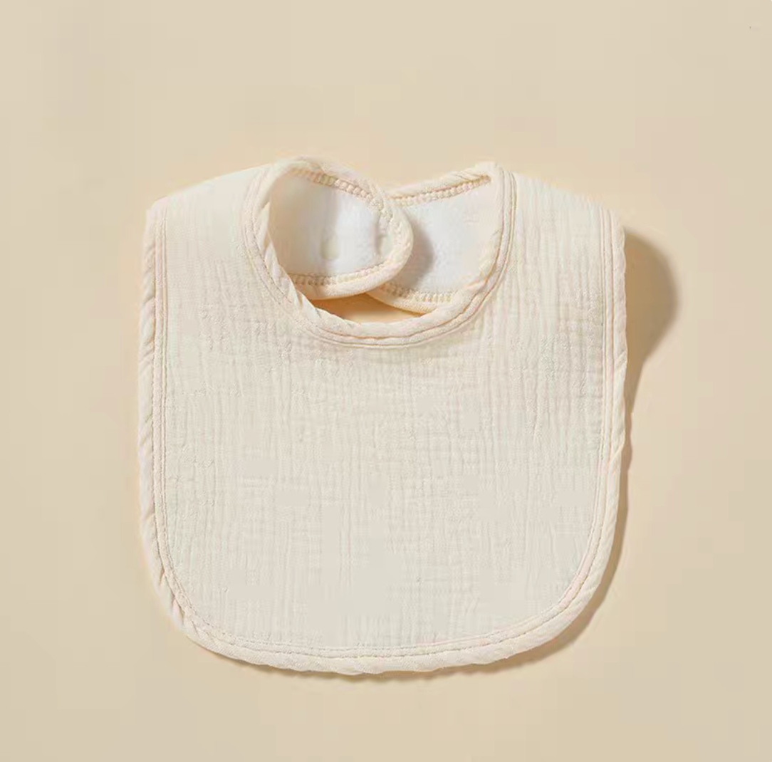 Cream baby cotton gauze bib with soft breathable fabric and rounded edges