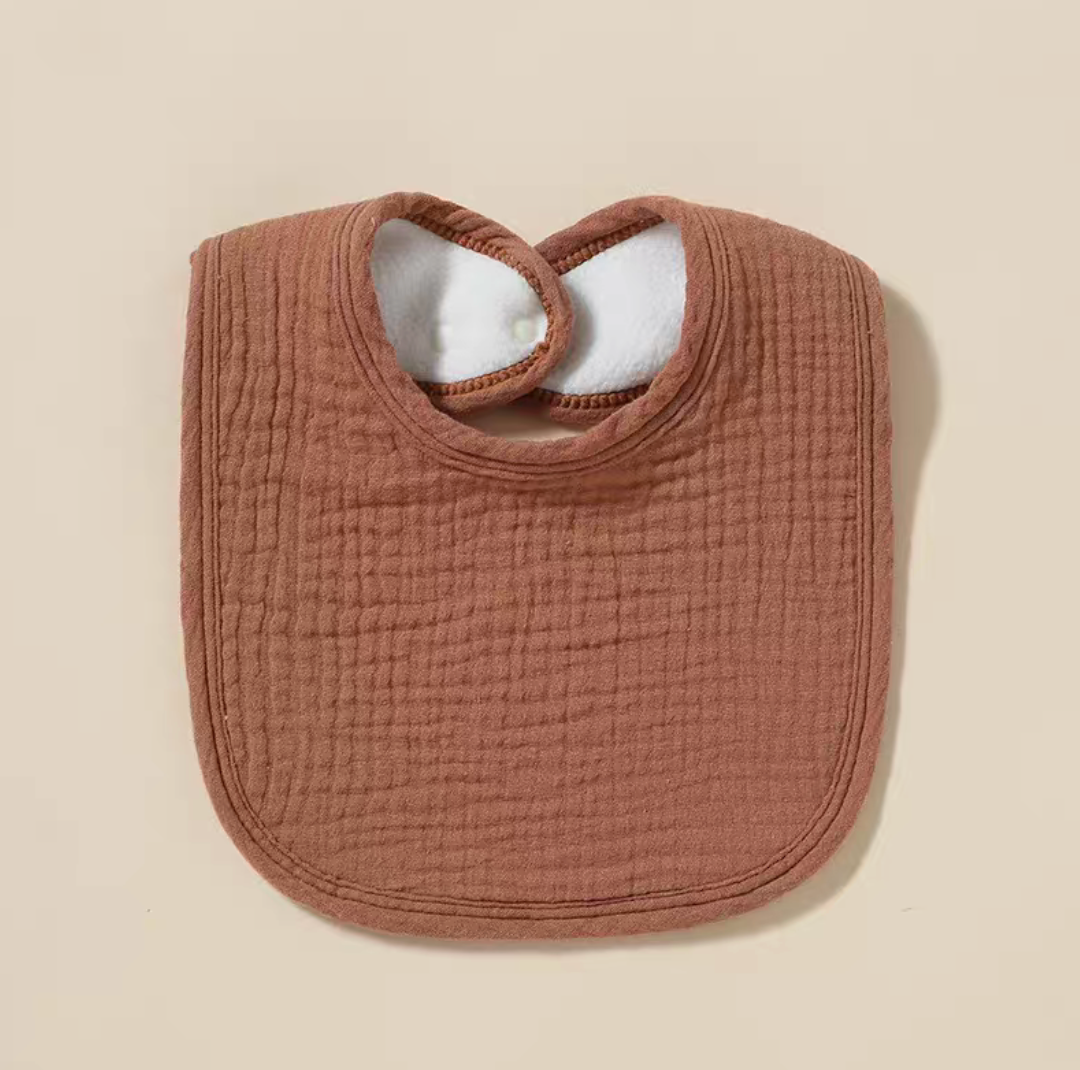 Dark Khaki baby cotton gauze bib with textured fabric and snap closure