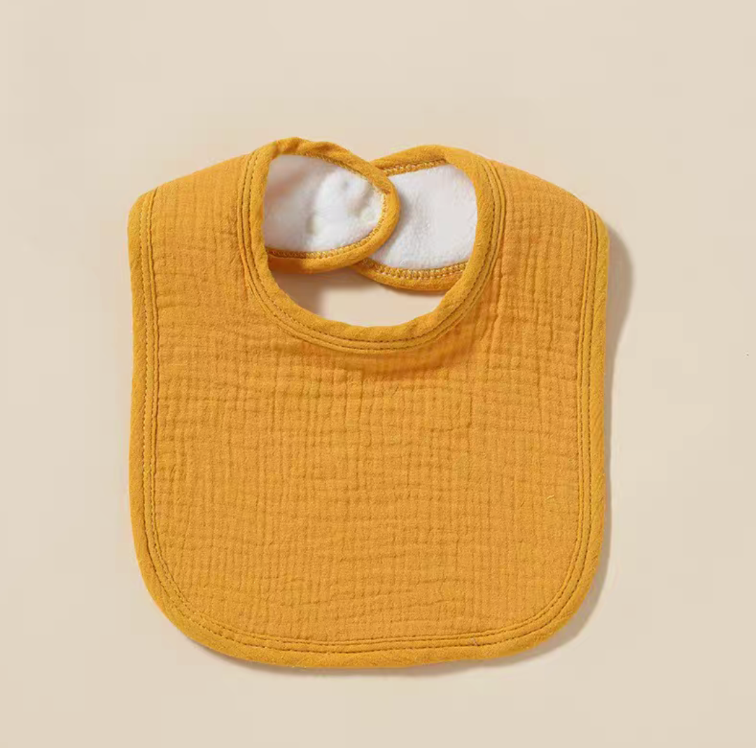 Yellow baby cotton gauze bib with bright color and soft absorbent material