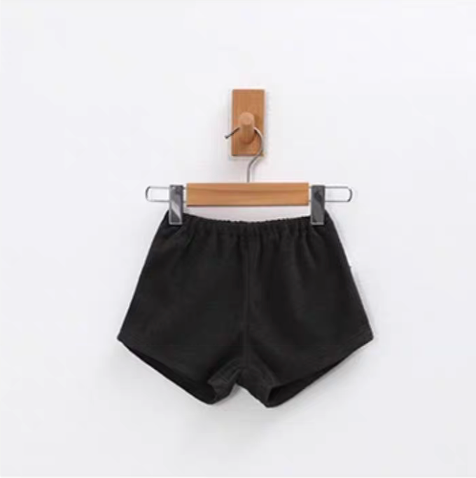 Charcoal baby terry cotton shorts with elastic waistband hanging on hanger