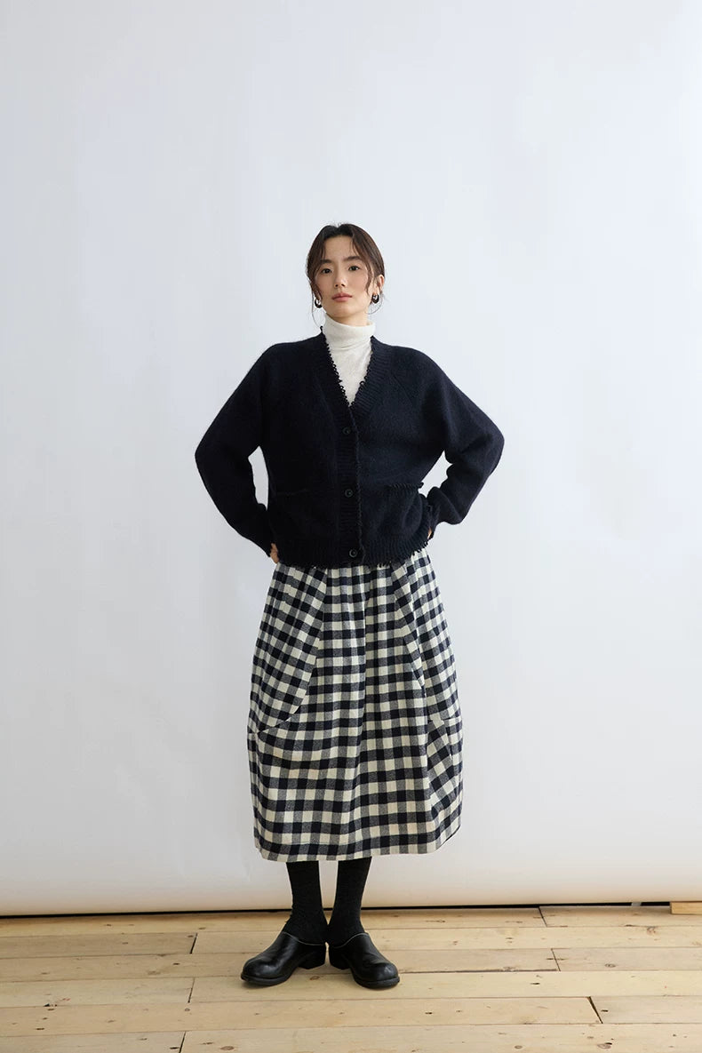 Full-length view of a black and cream gingham bubble midi skirt with gathered waist
