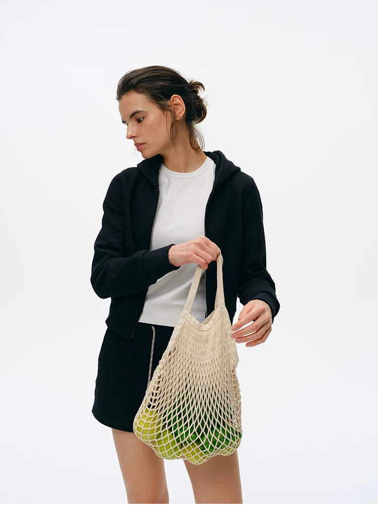 Three-quarter view of Black cropped zip hoodie and drawstring shorts set