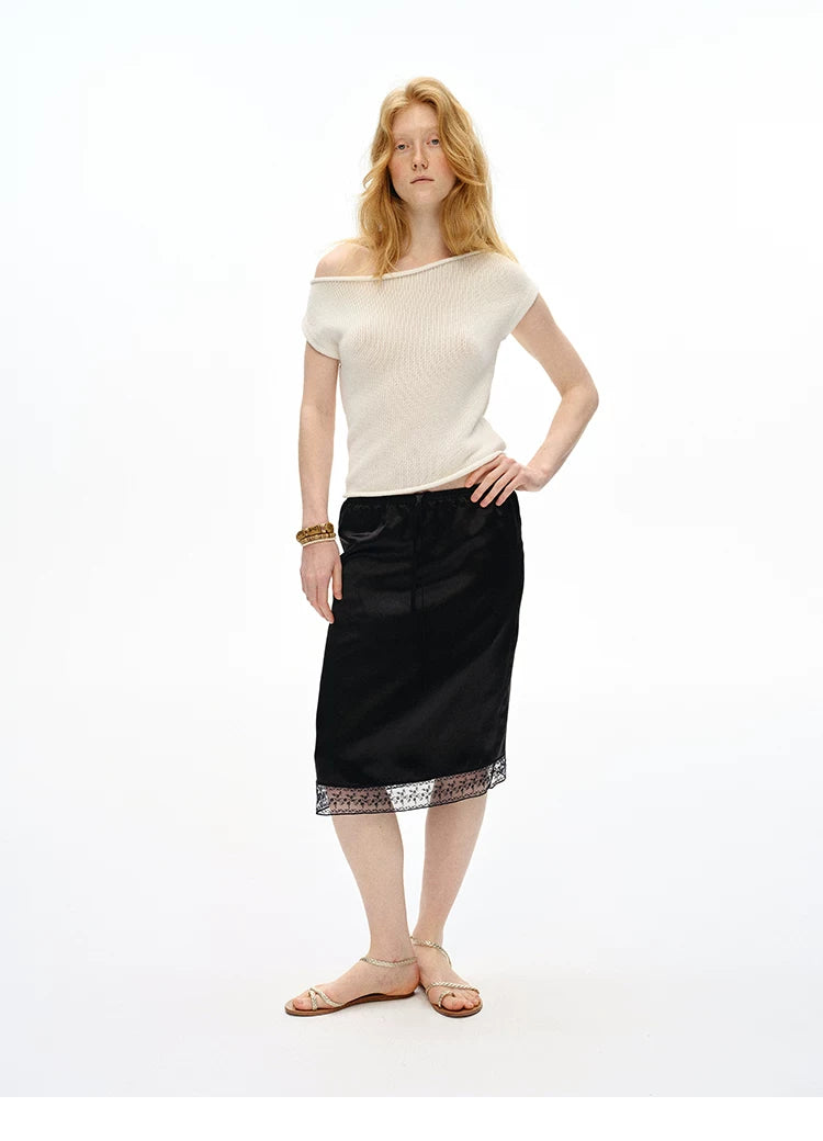 Full-length front view of Black straight slip skirt with lace trim