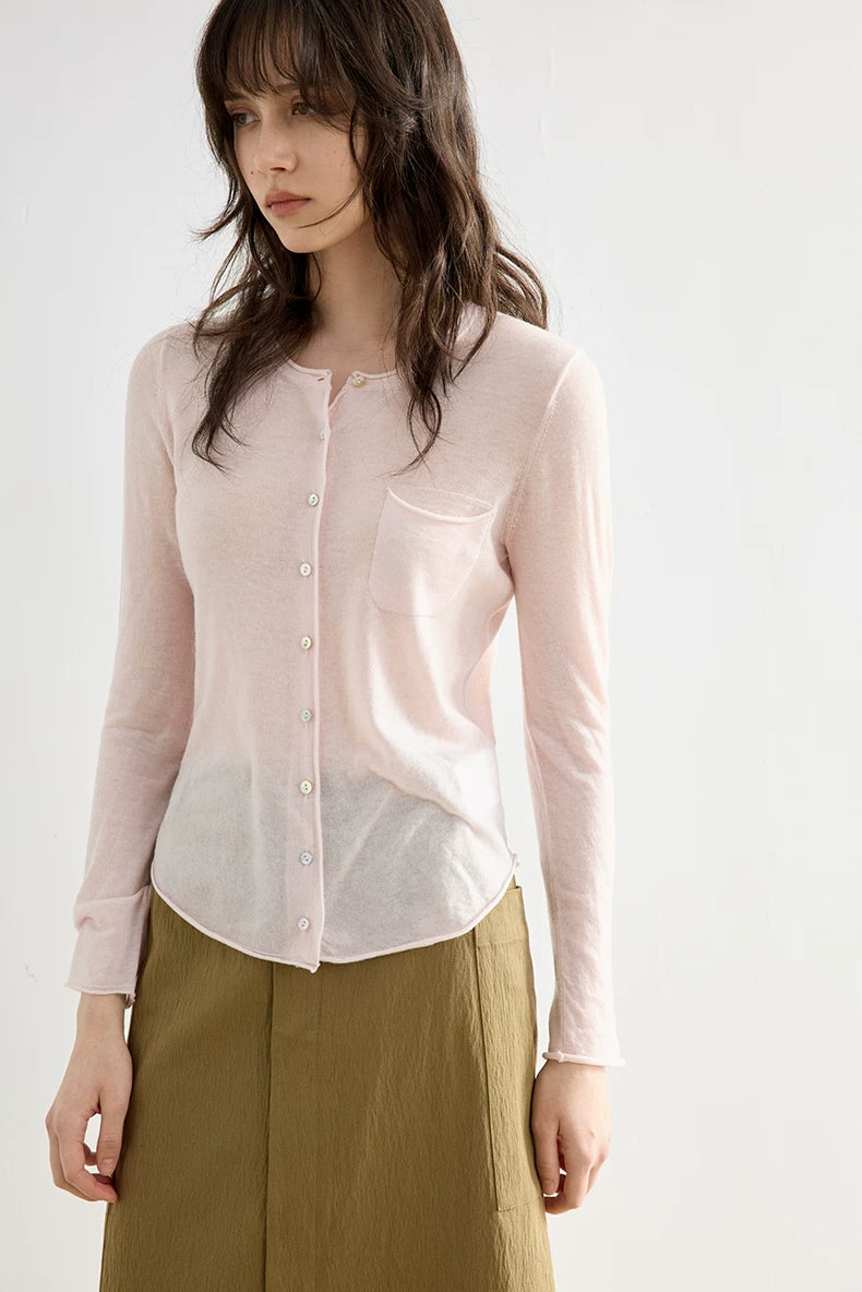 Blush Pink wool cardigan, close-up of round neckline and pearl-style buttons