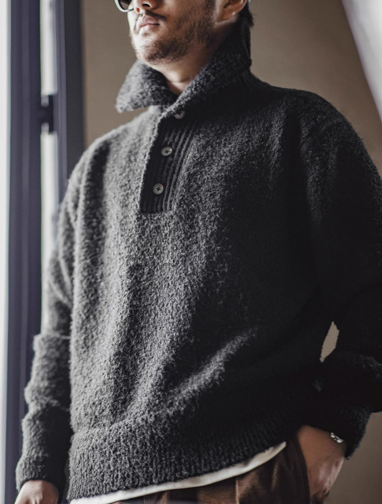 Side angle of Black Bouclé Polo Sweater showing texture and collar