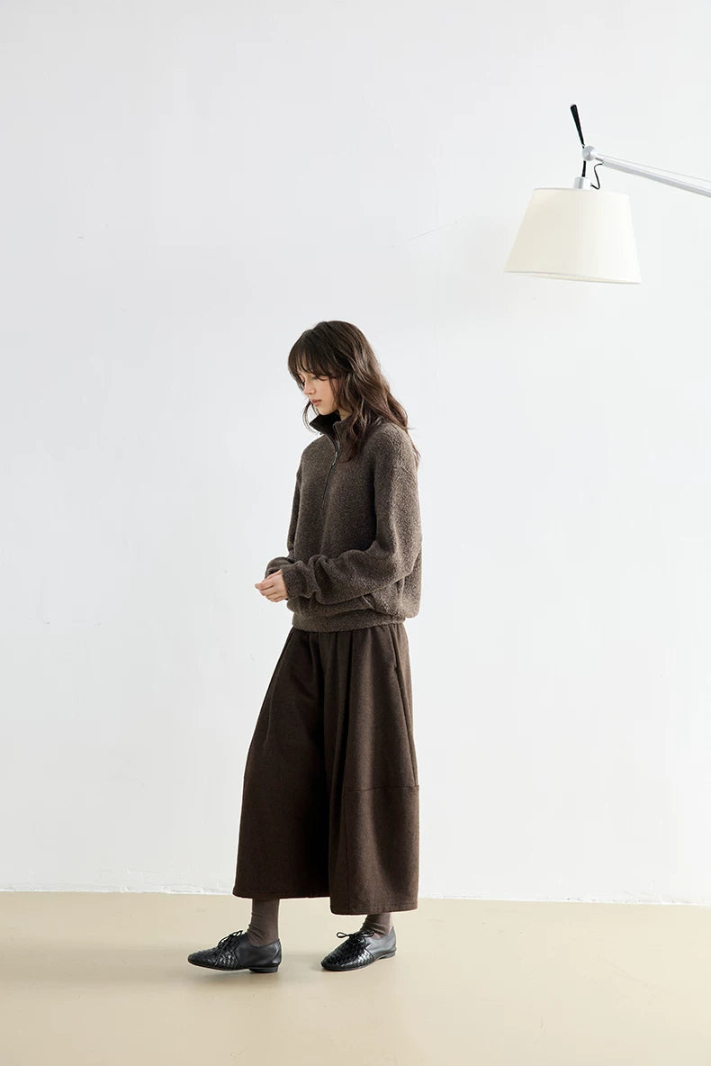 Brown bouclé wool half-zip pullover, side view styled with midi skirt