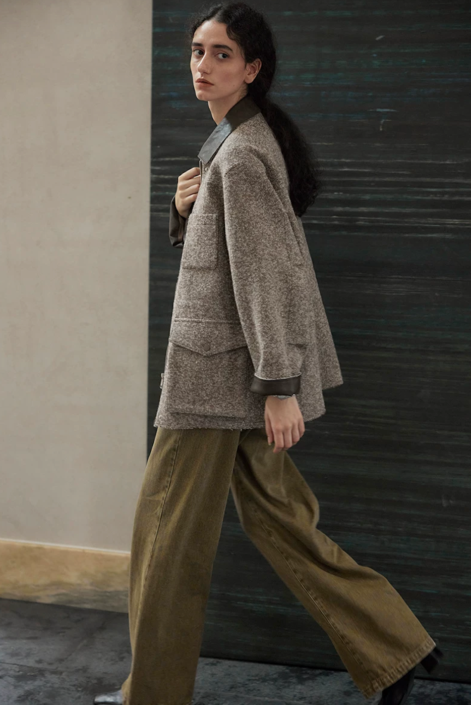 Side view of a Brown raw-edge wool jacket showing the chest patch pocket and flap cargo pocket