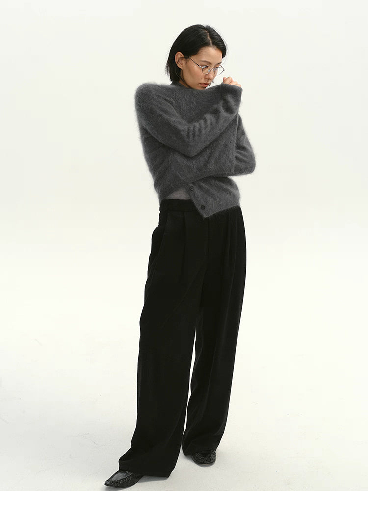 Full-body shot of charcoal brushed cashmere cardigan styled with wide-leg pants.