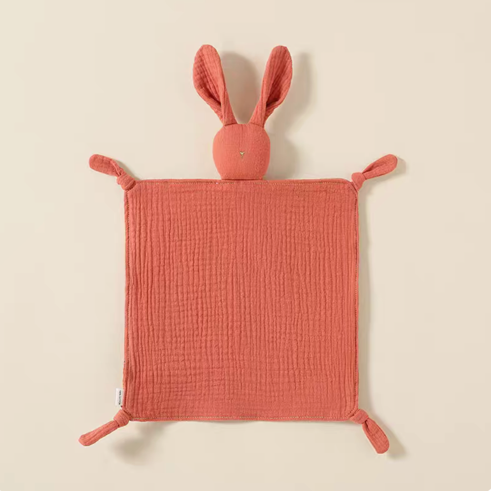 Orange bunny lovey teething toy flat lay front view in soft cotton muslin