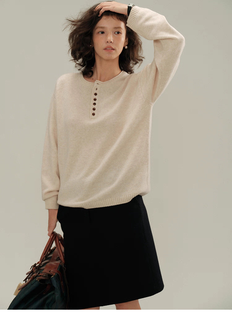 Model wearing cream almond Buttoned Henley Knit Pullover Sweater with button placket, front view