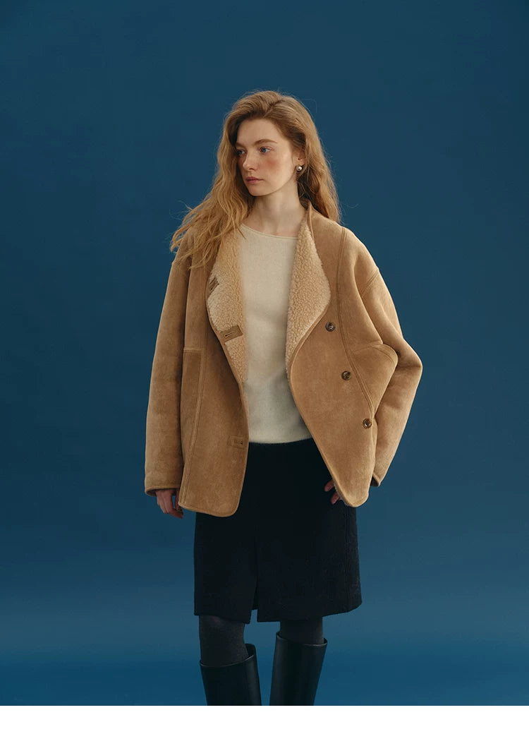Camel faux-shearling jacket worn with cream wool lapels folded open and button tabs visible