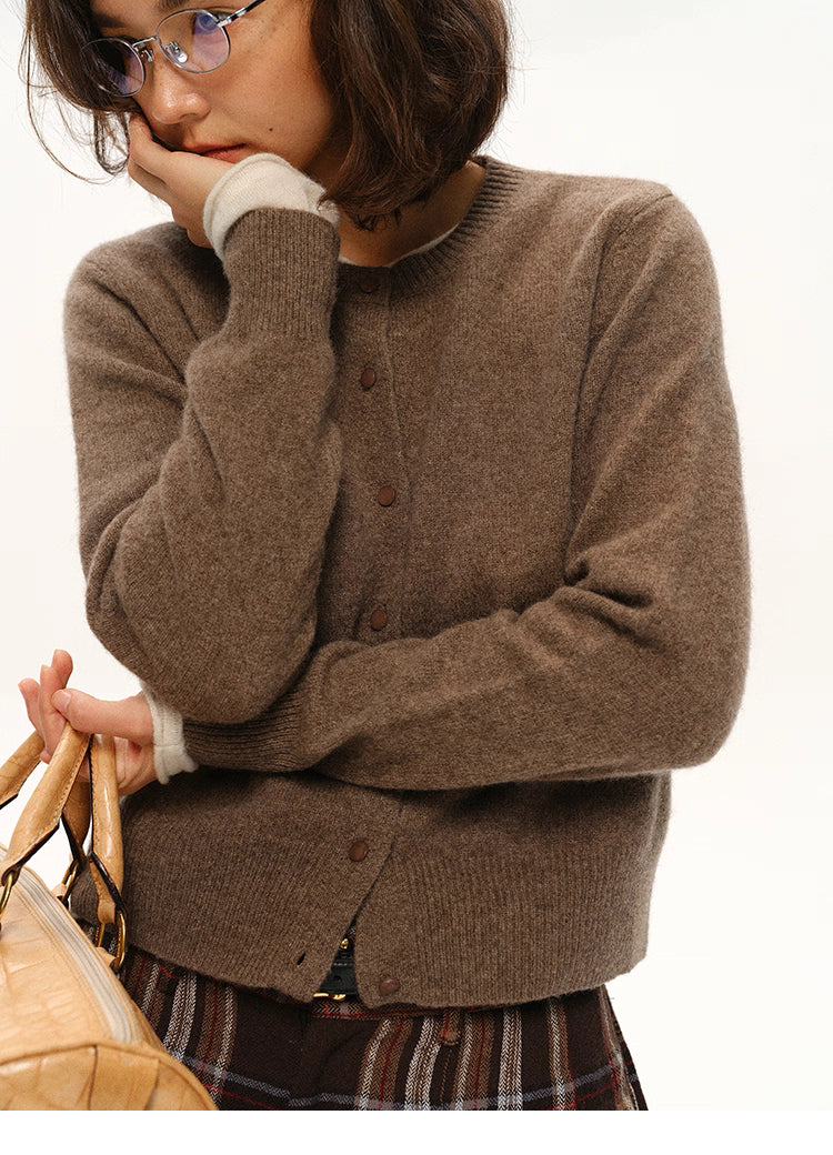 Woman holding bag while wearing coffee brown yak-cashmere cardigan