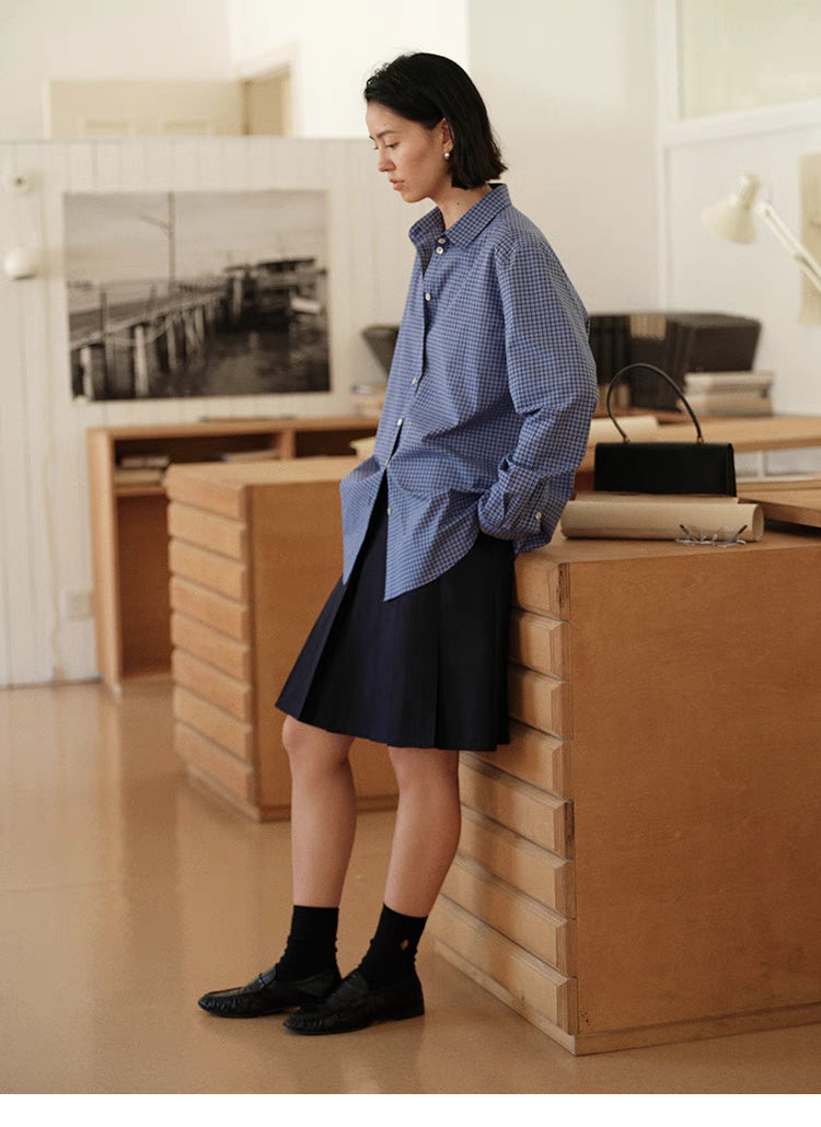 Checkered Ease Shirt blue plaid casual styling full body view leaning pose paired with skirt and loafers