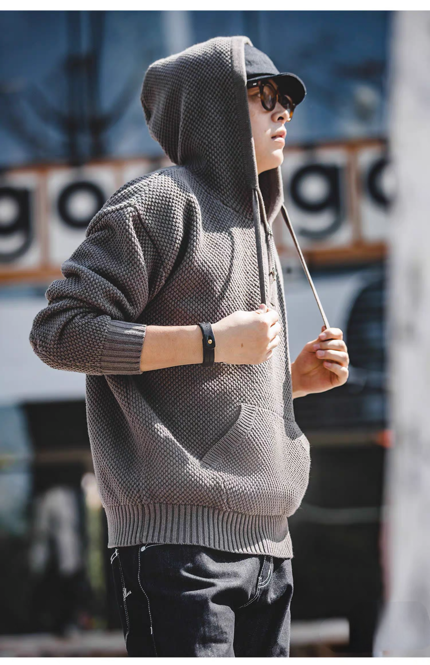 Chunky Waffle Knit Pullover Hoodie gray worn with hood up highlighting textured knit, drawstrings, and streetwear styling