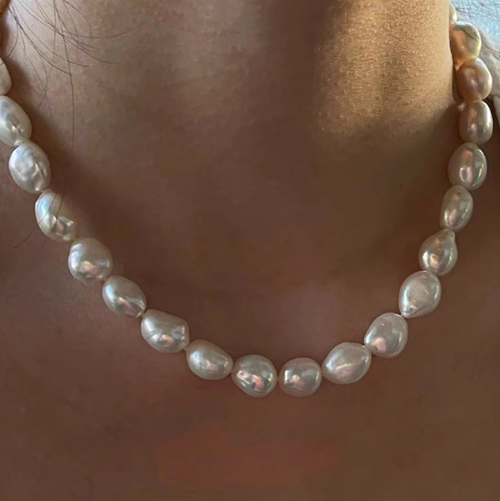 Classic Baroque Pearl Necklace on model neck detail featuring large natural baroque pearls