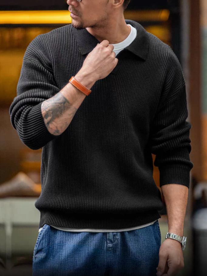 Classic Ribbed Knit Polo Sweater black worn in lifestyle setting with relaxed fit and ribbed knit texture