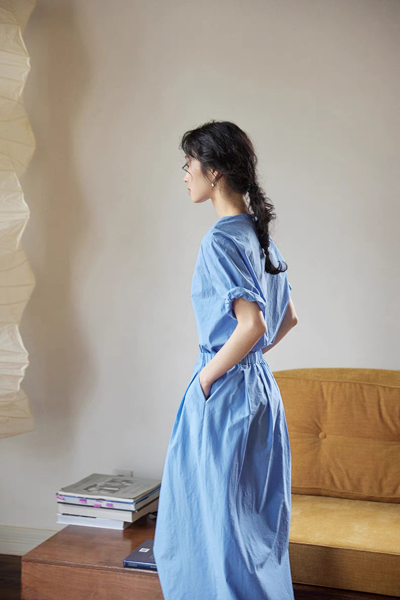 Side profile of Coastal Breeze Cotton Top & Skirt Set in blue highlighting pocket detail, elastic waist and flowy midi skirt silhouette