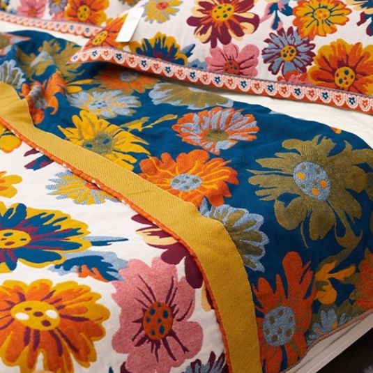 Close-up of Colorful Super Soft Long-staple Cotton Blanket Blooming showing colorful flower pattern on cotton fabric