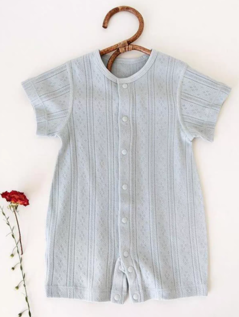 Gray blue cotton baby romper hanging on wooden hanger front view with vertical knit detail