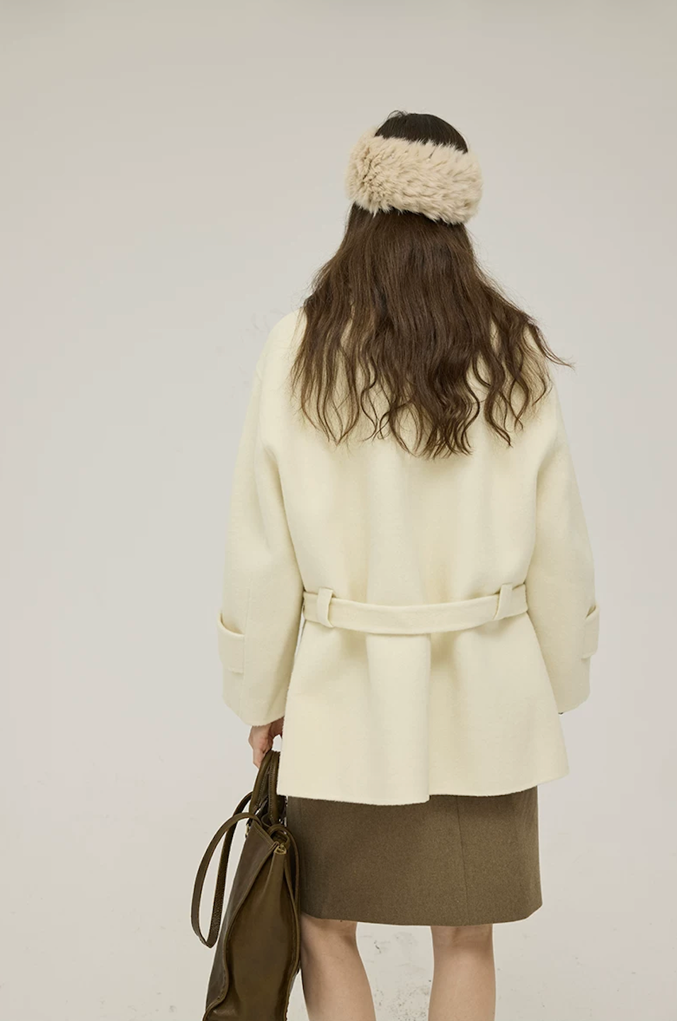 Back view of a Cream double-face wool coat belted through back loops