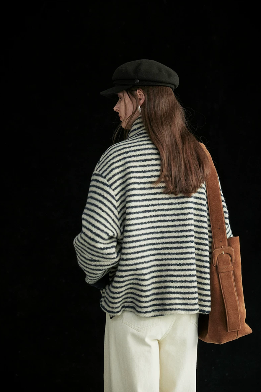 Back view of a Cream/Navy Stripe boxy cropped wool jacket with dropped shoulders