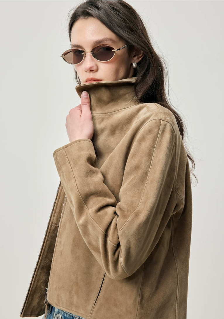 Close-up of fawn suede jacket with point collar turned up and soft matte nap