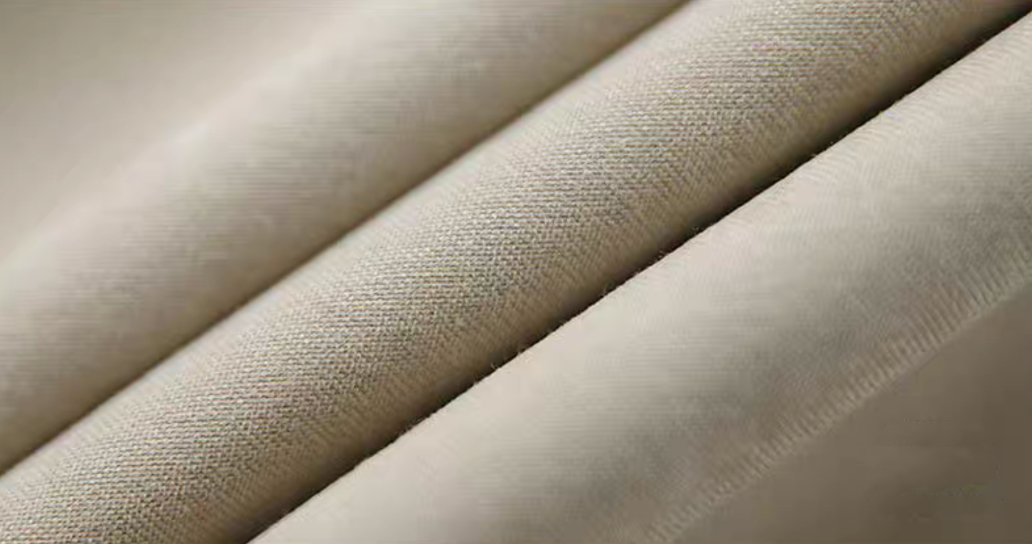 Close-up of light khaki Cuban collar shirt fabric texture.