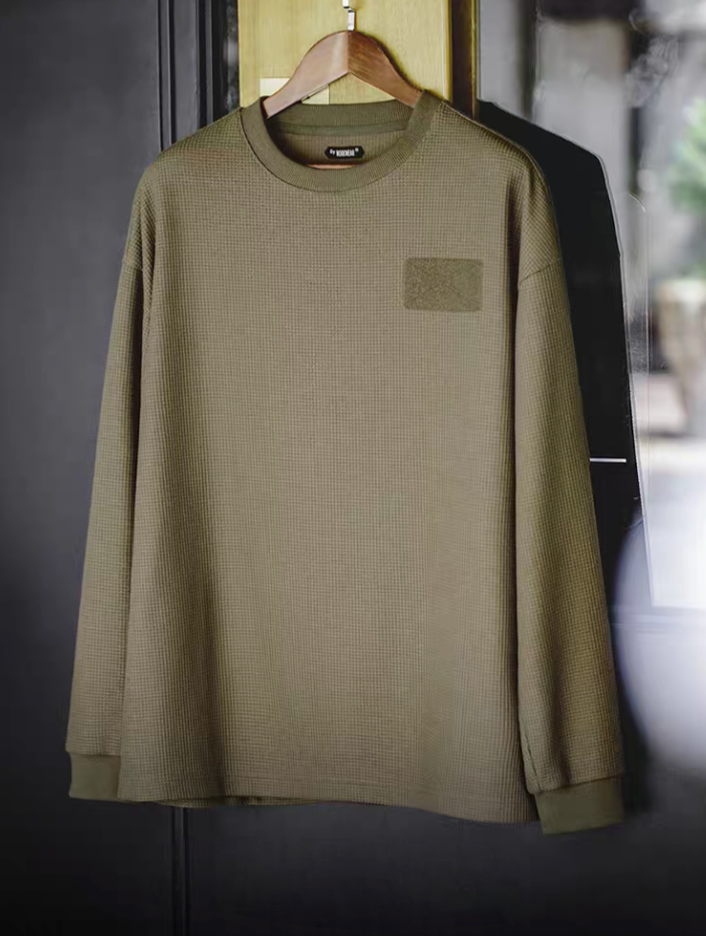 Custom Velcro long sleeve waffle tee in army green front view hanging showing waffle texture and chest velcro patch