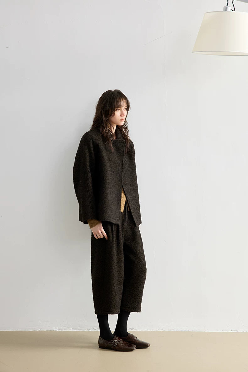 Full-length side view of a Dark Brown bouclé jacket and mid-calf cropped trousers