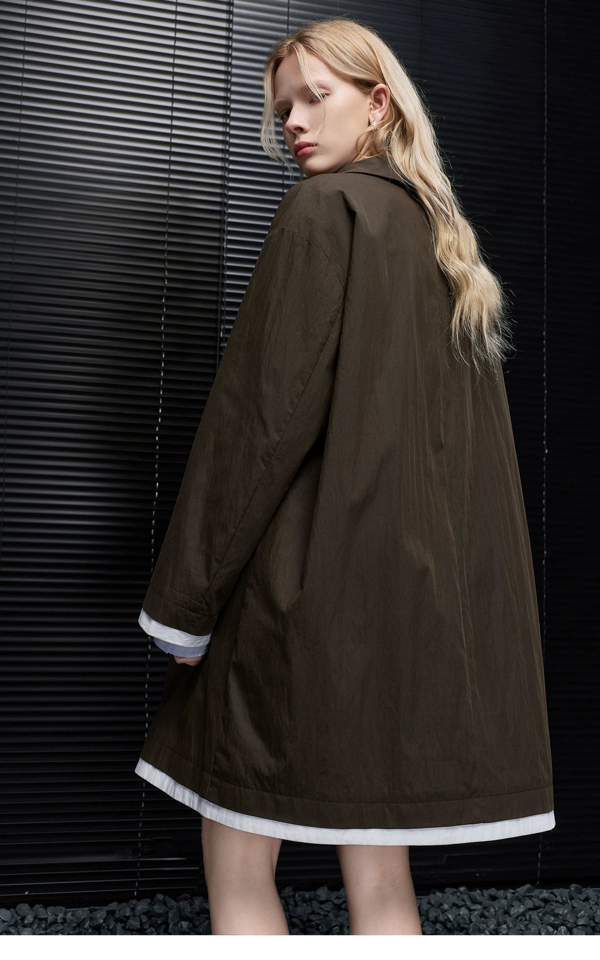 Back view of a Dark Brown cotton-blend mac coat with dropped shoulders and white hem trim