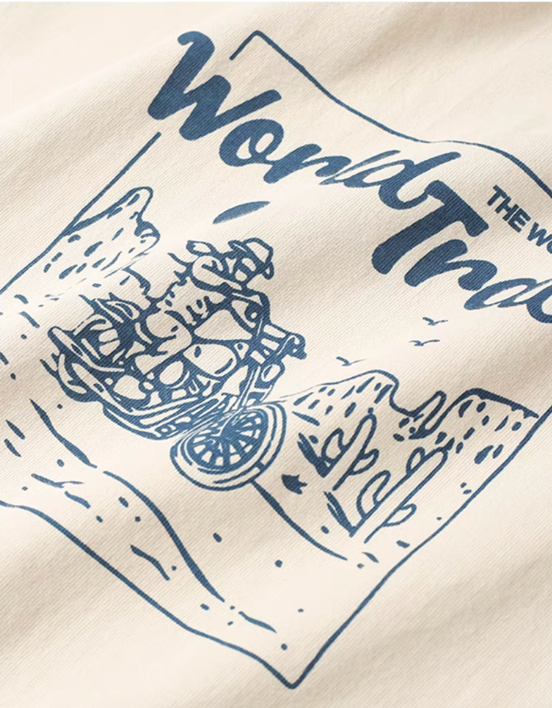 Desert Rider Graphic Cotton Tee Cream White close-up of motorcycle desert graphic showing cactus landscape and printed design detail