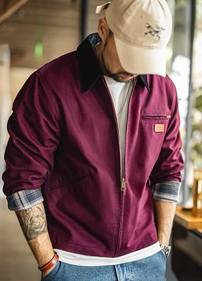 Burgundy Detroit work jacket styled with white tee and cap
