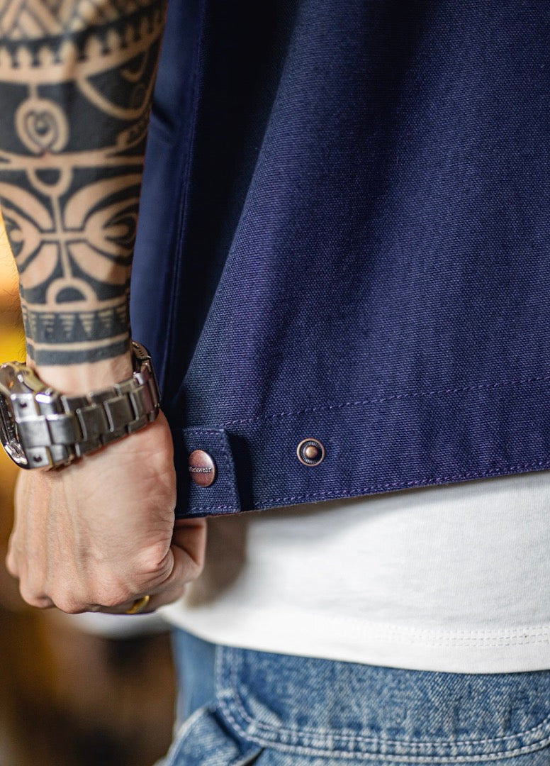 Hem and button detail of navy Detroit work jacket