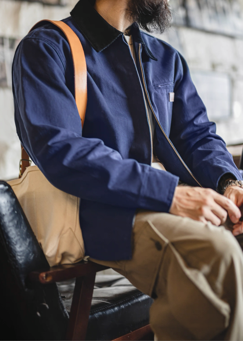 Hem and button detail of navy Detroit work jacket