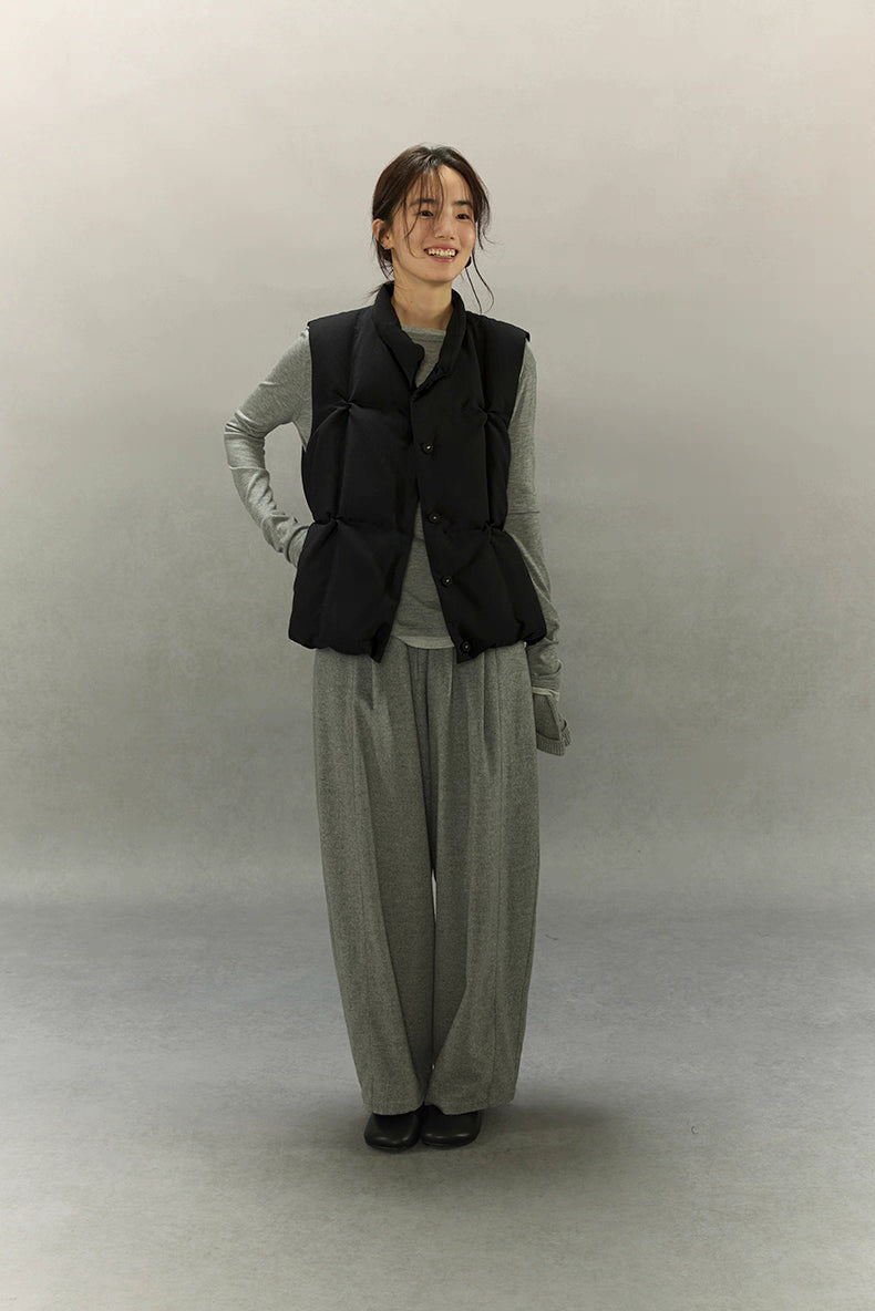full-body view of woman in black lightweight down vest with grey set