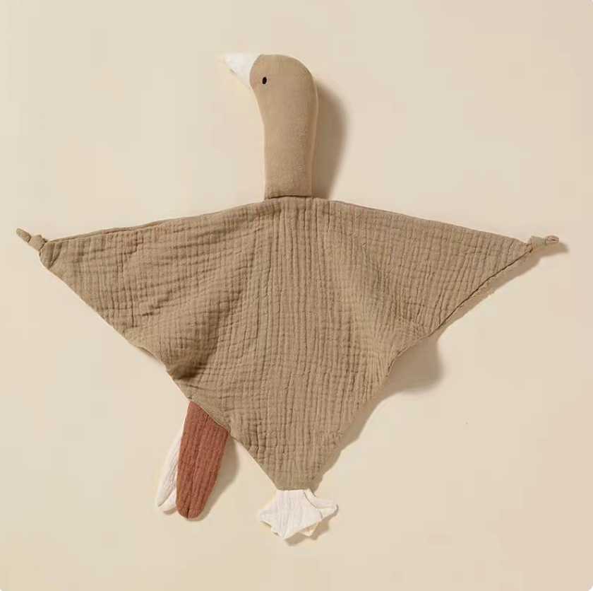 Gray duck lovey teething toy laid flat showing soft cotton muslin texture and neutral calming tone