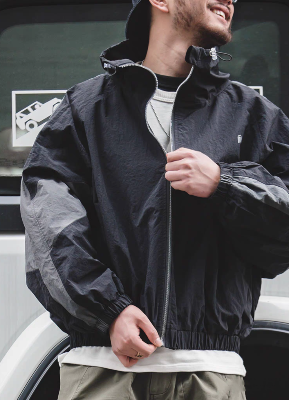 Front view of Sumatra Black Dynamic Layering Jacket worn by model showing relaxed fit and modern street style